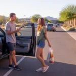 Two friends chat in a grocery store parking lot in Gilbert, Arizona at sunset