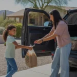 A family unloads groceries from their car outside their Scottsdale home on a sunny day