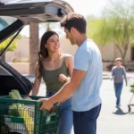 Couple unloading groceries outside neighborhood market in San Tan Valley, AZ