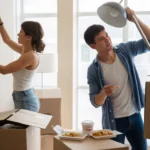 Couple unpacking in their new Scottsdale apartment surrounded by boxes