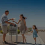 Neighbors chatting by community mailboxes on a sunny morning in Sunrise Manor, Nevada