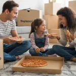 Family eating pizza on floor while unpacking in their new Taylorsville apartment