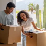 Couple unpacking in their new Fontana apartment on moving day