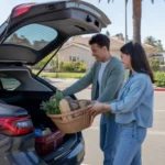 Couple loading groceries into car trunk in Tustin supermarket parking lot