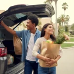 A couple unloading groceries from their car outside their Anaheim home
