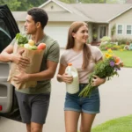 A couple unloads groceries from their car outside their Gastonia home on a sunny day